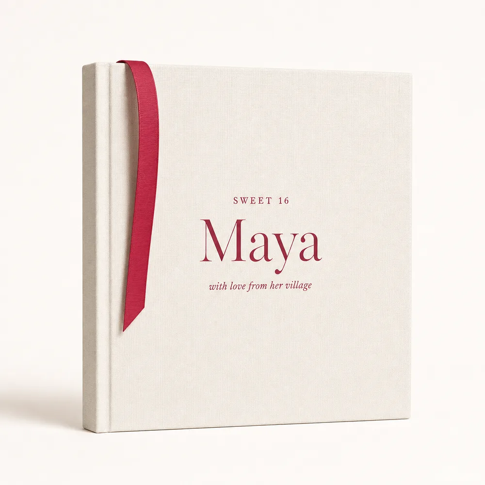 The clothbound hardcover keepsake book with its raspberry ribbon bookmark